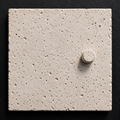 Dot concrete wall tile with minimal raised dot relief
