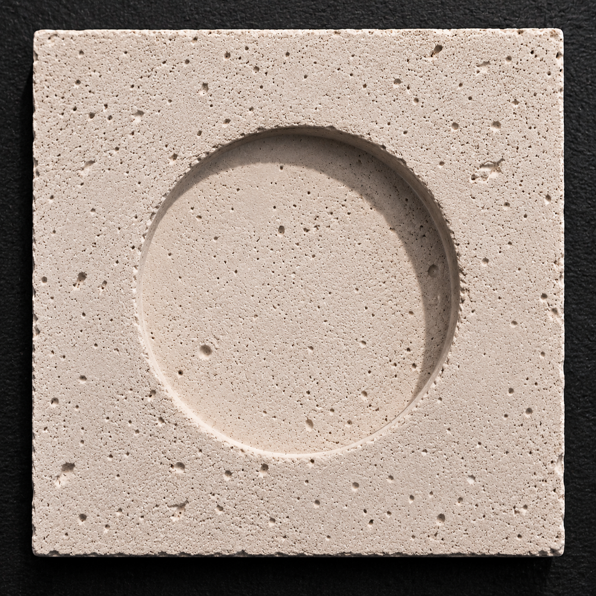Eclipse concrete wall tile with circular recessed relief